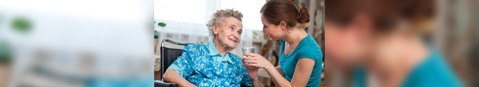 caregiver assisting old woman