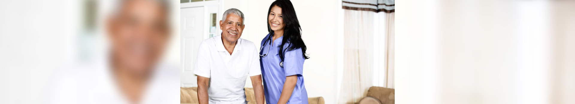 caregiver and old man standin in the living room